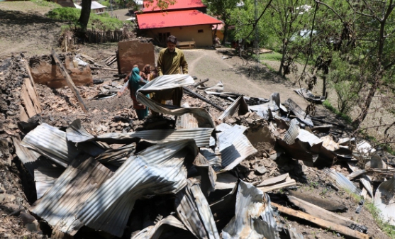 A Kashmiri resident inspecting a house